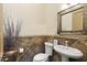Well-appointed powder room featuring decorative tile and modern fixtures at 7640 E Poinsettia Dr, Scottsdale, AZ 85260