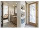 Stylish bathroom with granite counters, double sinks, and easy access to the bedroom and exterior at 7640 E Poinsettia Dr, Scottsdale, AZ 85260