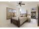 Serene bedroom with a four-poster bed, plantation shutters, and tranquil natural light at 7640 E Poinsettia Dr, Scottsdale, AZ 85260