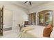 Bedroom with shuttered windows and doors, providing natural light and privacy at 7640 E Poinsettia Dr, Scottsdale, AZ 85260