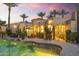 Stunning backyard view of home featuring a pool, mature landscaping, and inviting outdoor living spaces at 7640 E Poinsettia Dr, Scottsdale, AZ 85260