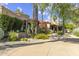 Beautiful single-story home with a circular driveway and meticulously maintained desert landscaping at 7640 E Poinsettia Dr, Scottsdale, AZ 85260