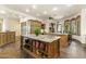 Gourmet kitchen with large island, granite counters, custom cabinets, and ample counter space at 7640 E Poinsettia Dr, Scottsdale, AZ 85260