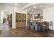 Gourmet kitchen featuring an island with seating, tile accents, and ample cabinet space at 7640 E Poinsettia Dr, Scottsdale, AZ 85260