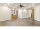 Large room with tiled floor and built-in cabinets, perfect for entertaining at 7640 E Poinsettia Dr, Scottsdale, AZ 85260