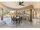 Charming outdoor space featuring a built-in grill, dining area, and refreshing pool views at 7640 E Poinsettia Dr, Scottsdale, AZ 85260