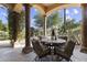 Charming covered patio with comfortable seating, perfect for outdoor dining and relaxation at 7640 E Poinsettia Dr, Scottsdale, AZ 85260