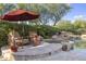 An outdoor pool with a lounge and spa area, surrounded by lush desert landscaping at 7640 E Poinsettia Dr, Scottsdale, AZ 85260