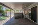 Covered back patio features brick pavers, recessed lights and provides access to the backyard's hot tub at 807 E San Remo Ave, Gilbert, AZ 85234