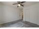 This is a bedroom with carpet and a ceiling fan and a sliding door closet at 807 E San Remo Ave, Gilbert, AZ 85234