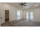This primary bedroom features carpet, a ceiling fan and ensuite bathroom access at 807 E San Remo Ave, Gilbert, AZ 85234