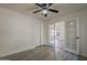 This is a bedroom with french doors, a ceiling fan, wood floors and a closet at 807 E San Remo Ave, Gilbert, AZ 85234
