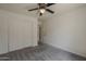 Carpeted bedroom with ceiling fan offers closet space at 807 E San Remo Ave, Gilbert, AZ 85234