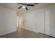 This is a bedroom with carpeted floors, ceiling fan, and large closet at 807 E San Remo Ave, Gilbert, AZ 85234