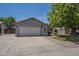 Charming single-story home featuring a spacious two-car garage and a well-maintained front yard with mature landscaping at 807 E San Remo Ave, Gilbert, AZ 85234