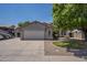 Charming single-story home featuring a spacious two-car garage and a well-maintained front yard with mature landscaping at 807 E San Remo Ave, Gilbert, AZ 85234