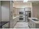 Modern kitchen showcasing gray cabinets, stainless steel appliances, island, and light-filled ambiance at 807 E San Remo Ave, Gilbert, AZ 85234