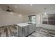 Kitchen island features stainless steel dishwasher, sink, white marble countertop, and stylish open space at 807 E San Remo Ave, Gilbert, AZ 85234