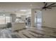 Spacious open-concept kitchen with stainless steel appliances, island, and stylish flooring leading to living area at 807 E San Remo Ave, Gilbert, AZ 85234