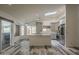 Bright kitchen featuring modern gray cabinetry, stainless steel appliances, and island with sleek countertops at 807 E San Remo Ave, Gilbert, AZ 85234
