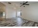 Bright living room features wood-look floors, fresh white walls, ample natural light, and an archway at 807 E San Remo Ave, Gilbert, AZ 85234