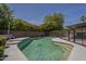Backyard pool is surrounded by lush greenery, offering privacy and a refreshing outdoor experience at 807 E San Remo Ave, Gilbert, AZ 85234