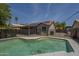 Inviting pool with fence, landscaping, and a view of the covered patio, grill and home at 807 E San Remo Ave, Gilbert, AZ 85234