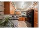Well-lit kitchen features wooden cabinets, granite countertops, stainless steel appliances and modern lighting at 8787 E Mountain View Rd # 1110, Scottsdale, AZ 85258