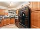 This open kitchen includes granite countertops, wooden cabinets, and stainless steel appliances at 8787 E Mountain View Rd # 1110, Scottsdale, AZ 85258