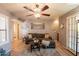 Living room with a ceiling fan, wood flooring, and neutral decor at 8787 E Mountain View Rd # 1110, Scottsdale, AZ 85258