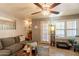 Cozy living room with a ceiling fan, wood floor, and neutral decor at 8787 E Mountain View Rd # 1110, Scottsdale, AZ 85258