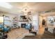 Bright living room featuring wood flooring, neutral paint, fireplace and a decorative ceiling fan at 8787 E Mountain View Rd # 1110, Scottsdale, AZ 85258