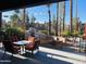 Inviting outdoor patio with comfortable seating and scenic views of the community amenities at 8787 E Mountain View Rd # 1110, Scottsdale, AZ 85258