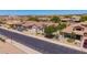 The aerial showcases a charming home with low-maintenance landscaping, a tile roof and well-kept surroundings at 9623 S 25Th Ln, Phoenix, AZ 85041