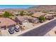 This aerial view highlights a charming home with low-maintenance landscaping and mountain scenery at 9623 S 25Th Ln, Phoenix, AZ 85041