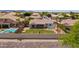 Expansive backyard featuring well-manicured lawn, covered patio, and pool, perfect for outdoor living at 9623 S 25Th Ln, Phoenix, AZ 85041