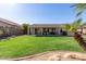 Beautiful backyard features a well-maintained lawn and covered patio, perfect for relaxing outdoors at 9623 S 25Th Ln, Phoenix, AZ 85041
