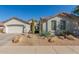 Charming single-story home featuring desert landscaping, a tile roof, and a two-car garage at 9623 S 25Th Ln, Phoenix, AZ 85041