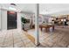 Spacious game room with a pool table, tile floors, and an entertainment area at 1 W Canterbury Ln, Phoenix, AZ 85023