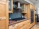 Beautiful kitchen with modern appliances, stylish cabinets, and tile backsplash providing an aesthetic appeal at 1 W Canterbury Ln, Phoenix, AZ 85023