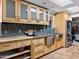 Modern kitchen with stainless steel appliances, open storage, and custom cabinetry at 1 W Canterbury Ln, Phoenix, AZ 85023