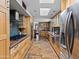 Gourmet kitchen features stainless steel appliances, and ample counter space at 1 W Canterbury Ln, Phoenix, AZ 85023