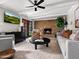 Bright living room with brick fireplace, stylish decor, and plenty of natural light at 1 W Canterbury Ln, Phoenix, AZ 85023
