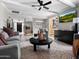 Inviting living room featuring neutral colors, stylish furniture, and seamless kitchen access at 1 W Canterbury Ln, Phoenix, AZ 85023