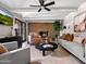 This second view of the living room shows a fireplace and access to the pool at 1 W Canterbury Ln, Phoenix, AZ 85023
