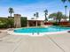 Inviting pool area surrounded by lush greenery and a covered patio, perfect for outdoor relaxation and entertainment at 1 W Canterbury Ln, Phoenix, AZ 85023