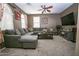 Inviting living room showcasing a large gray sectional sofa, patterned pillows, and natural light at 10136 E Isleta Ave, Mesa, AZ 85209