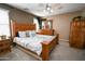 Relaxing bedroom with an inviting bed and an elegant dresser in a cozy setting at 10136 E Isleta Ave, Mesa, AZ 85209