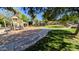 Community playground and park with play structures, walking paths, and lush green spaces, perfect for outdoor activities at 10136 E Isleta Ave, Mesa, AZ 85209