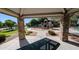 Shaded picnic area with views of the playground and surrounding community, creating a relaxing gathering spot at 10136 E Isleta Ave, Mesa, AZ 85209